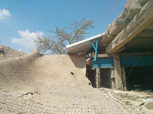 dost ali shoro a small business owner has installed a solar panel on the top of a thatched roof photo bilal memon express dost ali shoro a small business owner has installed a solar panel on the top of a thatched roof photo bilal memon express