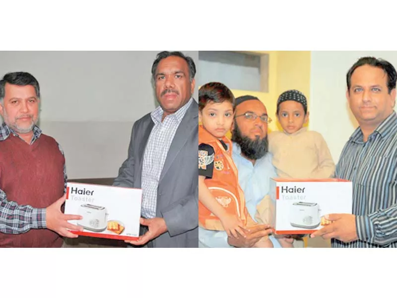 daily express lahore chief reporter khalid qayum and daily express karachi sports editor salim khaliq hand over the prizes photo express daily express lahore chief reporter khalid qayum and daily express karachi sports editor salim khaliq hand over the prizes photo express