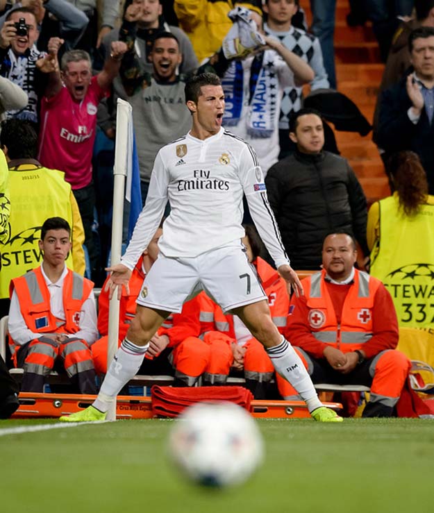 real madrid 039 s portuguese forward cristiano ronaldo celebrates his second goal after scoring during the round of 16 second leg uefa champions league football match real madrid cf vs fc shalke 04 at the santiago bernabeu stadium in madrid on march 10 2015 photo afp