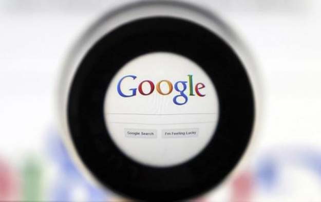 a google search page is seen through a magnifying glass in this photo illustration taken in brussels may 30 2014 photo reuters