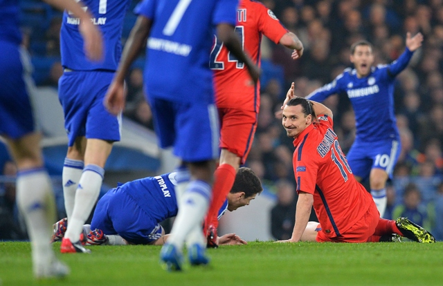 paris saint germain 039 s swedish forward zlatan ibrahimovic below r gestures to the referee after a clash with chelsea 039 s brazilian midfielder oscar below l which resulted in a red card for ibrahimovic during the uefa champions league round of 16 second leg football match between chelsea and paris saint germain at stamford bridge in london on march 11 2015 photo afp