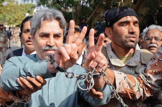 mqm central leader amir khan is being escorted back to the vehicle by rangers personnel after being presented before an anti terrorism court photo inp mqm central leader amir khan is being escorted back to the vehicle by rangers personnel after being presented before an anti terrorism court photo inp