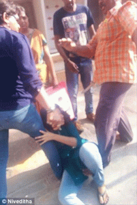 young girl beaten by father amid crowds over rumours of her dating