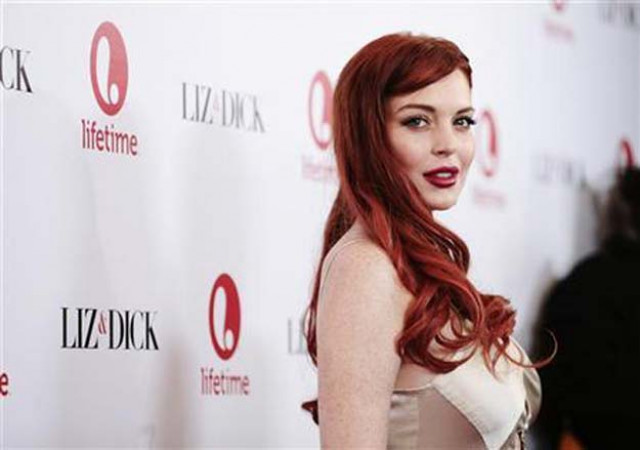 lohan has been criticised by fans who said the picture appeared distorted around her legs photo reuters lohan has been criticised by fans who said the picture appeared distorted around her legs photo reuters