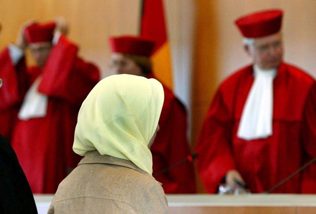 picture taken on september 24 2003 in karlsruhe southern germany shows muslim teacher fereshta ludin and lawyers of the german constitutional court after a verdict was spoken on wearing a headscarf in class photo afp