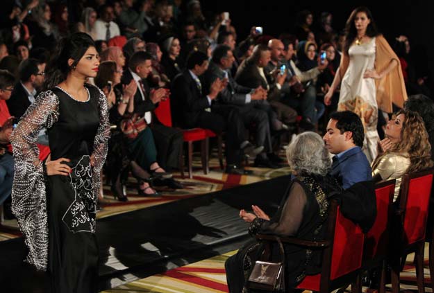 iraqi models pose for a photo in the backstage during the 2015 baghdad fashion show on march 13 2015 at baghdad 039 s royal tulip hotel known to iraqis as the rasheed around 500 people turned out in their best attire to watch 16 young iraqi women model collections by six home grown fashion designers as an oriental beat shook the walls of the refurbished gala hall photo afp