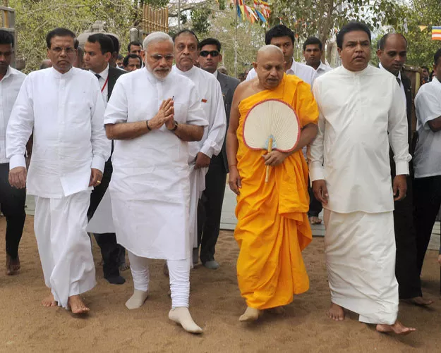 in this handout photograph received from the press information bureau pib on march 14 2015 indian prime minister narendra modi 2l and sri lankan president maithripala sirisena l offer prayers at the sri maha bodhi tree in anuradhapura photo afp in this handout photograph received from the press information bureau pib on march 14 2015 indian prime minister narendra modi 2l and sri lankan president maithripala sirisena l offer prayers at the sri maha bodhi tree in anuradhapura photo afp
