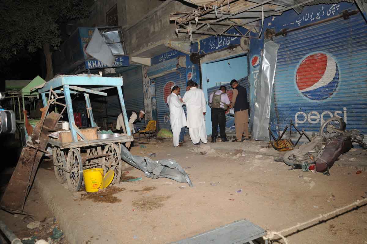 officials inspect the site of a blast in orangi town area of karachi on saturday evening photo mohammad noman express