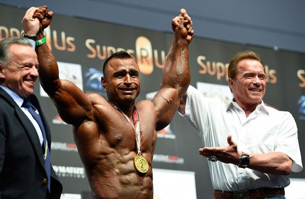 arnold schwarzenegger poses with atif anwar the winner of arnold classic over 100 class photo courtesy getty