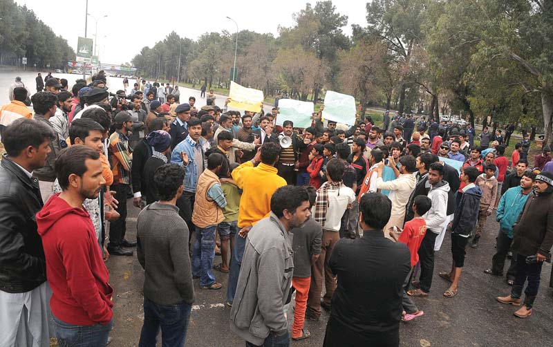 christian residents stage a demonstration on a section of islamabad expressway to protest the suicide attacks on churches in lahore on sunday photo waseem nazir express