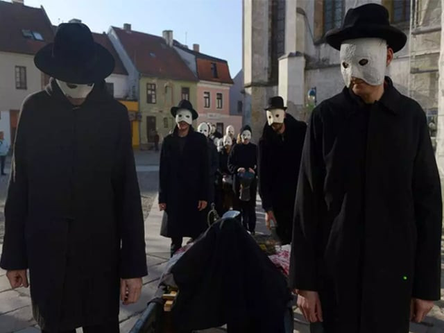 each face with a bright mask of pity stitched perfectly on them photo getty
