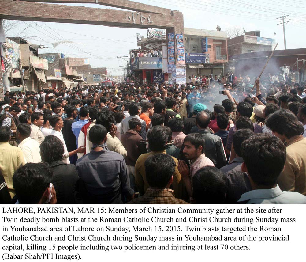 members of the christian community gather at the site after twin deadly bomb blasts at the roman catholic church and christ church during sunday mass in youhanabad area of lahore photo ppi