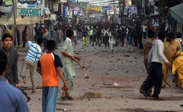 demonstrators clash during a protest in lahore on march 16 2015 photo afp