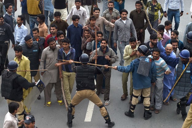 a 1 000 strong police contingent was deployed in the area they fired tear gas shells and water cannons to disperse the rioters rangers were also called in to ensure law and order photo tariq hassan express