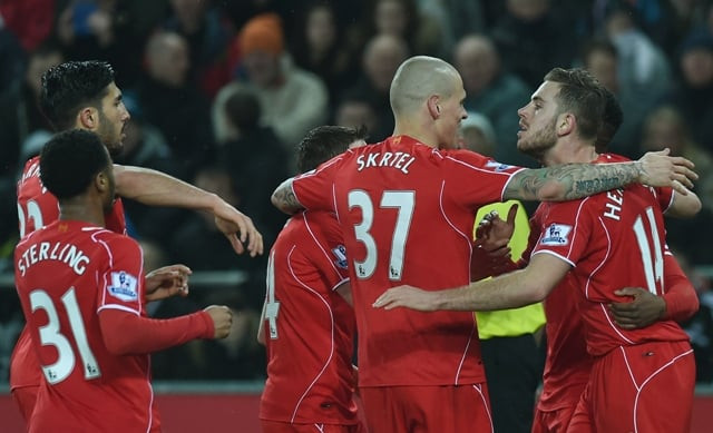 liverpool 039 s players celebrate the opening goal by english midfielder jordan henderson r during the english premier league football match between swansea city and liverpool at the liberty stadium in swansea south wales on march 16 2015 photo afp liverpool 039 s players celebrate the opening goal by english midfielder jordan henderson r during the english premier league football match between swansea city and liverpool at the liberty stadium in swansea south wales on march 16 2015 photo afp