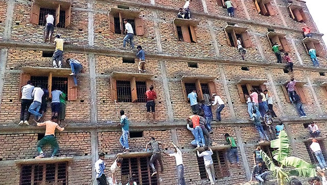 family members and friends climb walls to make answer chits available to those appearing for their class 10 exams at a centre in vaishali bihar photo courtesy hindustan times family members and friends climb walls to make answer chits available to those appearing for their class 10 exams at a centre in vaishali bihar photo courtesy hindustan times