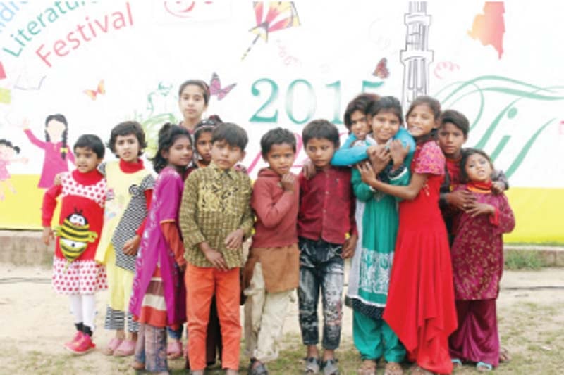 children gather for a photograph at the event photo abid nawaz express