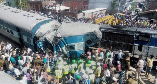 villagers police and railway guards were trying to rescue passengers trapped in the coaches photo courtesy the press trust of india villagers police and railway guards were trying to rescue passengers trapped in the coaches photo courtesy the press trust of india