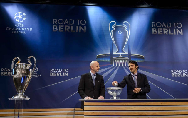 uefa secretary general gianni infantino l and the ambassador for the uefa champions league final in berlin karl heinz riedle attend the draw for the uefa champions league quarter final football matches at the uefa headquarters in nyon on march 20 2015 photo afp uefa secretary general gianni infantino l and the ambassador for the uefa champions league final in berlin karl heinz riedle attend the draw for the uefa champions league quarter final football matches at the uefa headquarters in nyon on march 20 2015 photo afp