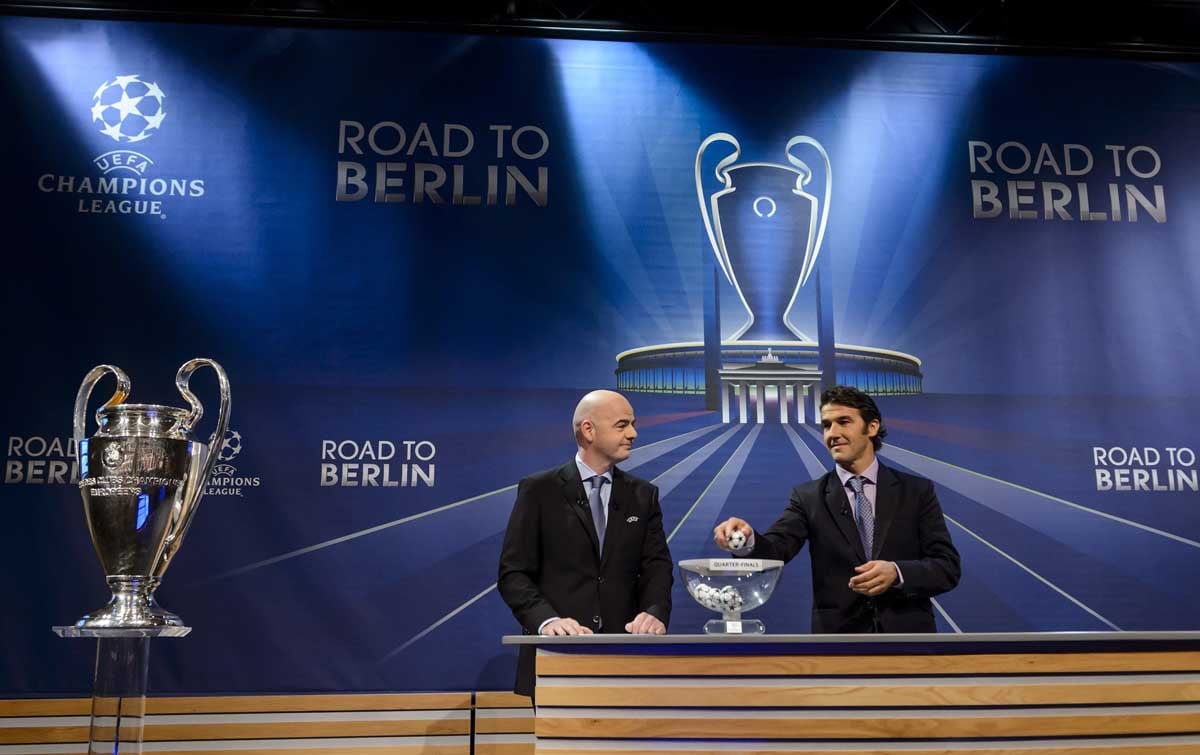 uefa secretary general gianni infantino l and the ambassador for the uefa champions league final in berlin karl heinz riedle attend the draw for the uefa champions league quarter final football matches at the uefa headquarters in nyon on march 20 2015 photo afp