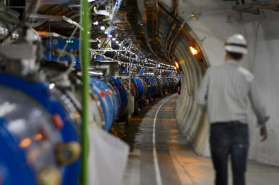 scientists attempt to rewrite laws of physics as they fire up large hadron collidor
