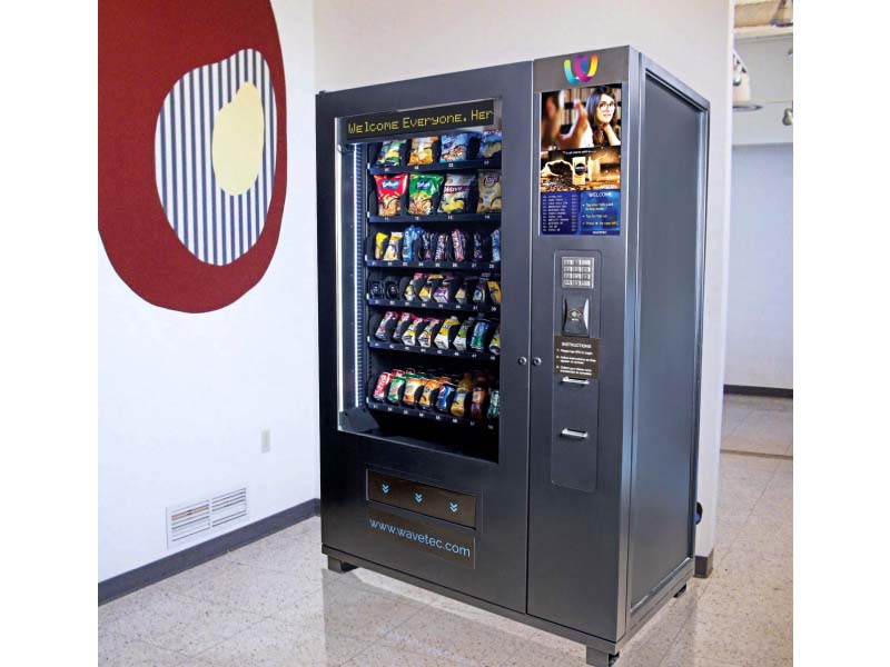 nfc enables users to wave over their smartphones or tap their plastic cards to an nfc enabled vending machine which then dispenses the item selected by the user photo wavetec