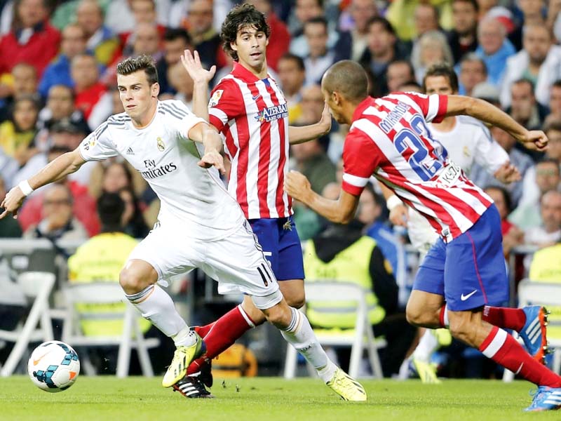 real will face city rivals atletico in the last eight of the champions league after friday s draw set up a repeat of last year s final photo afp