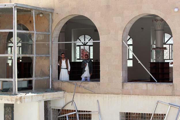 people examine the damage caused to badr mosque after the blasts in sanaa photo afp