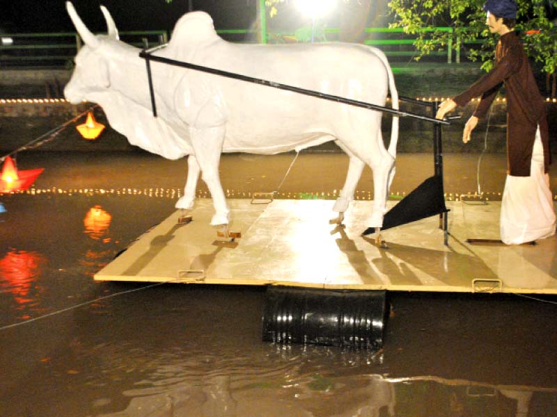 a float depicting a farmer with a ox drawn plough photo abid nawaz express