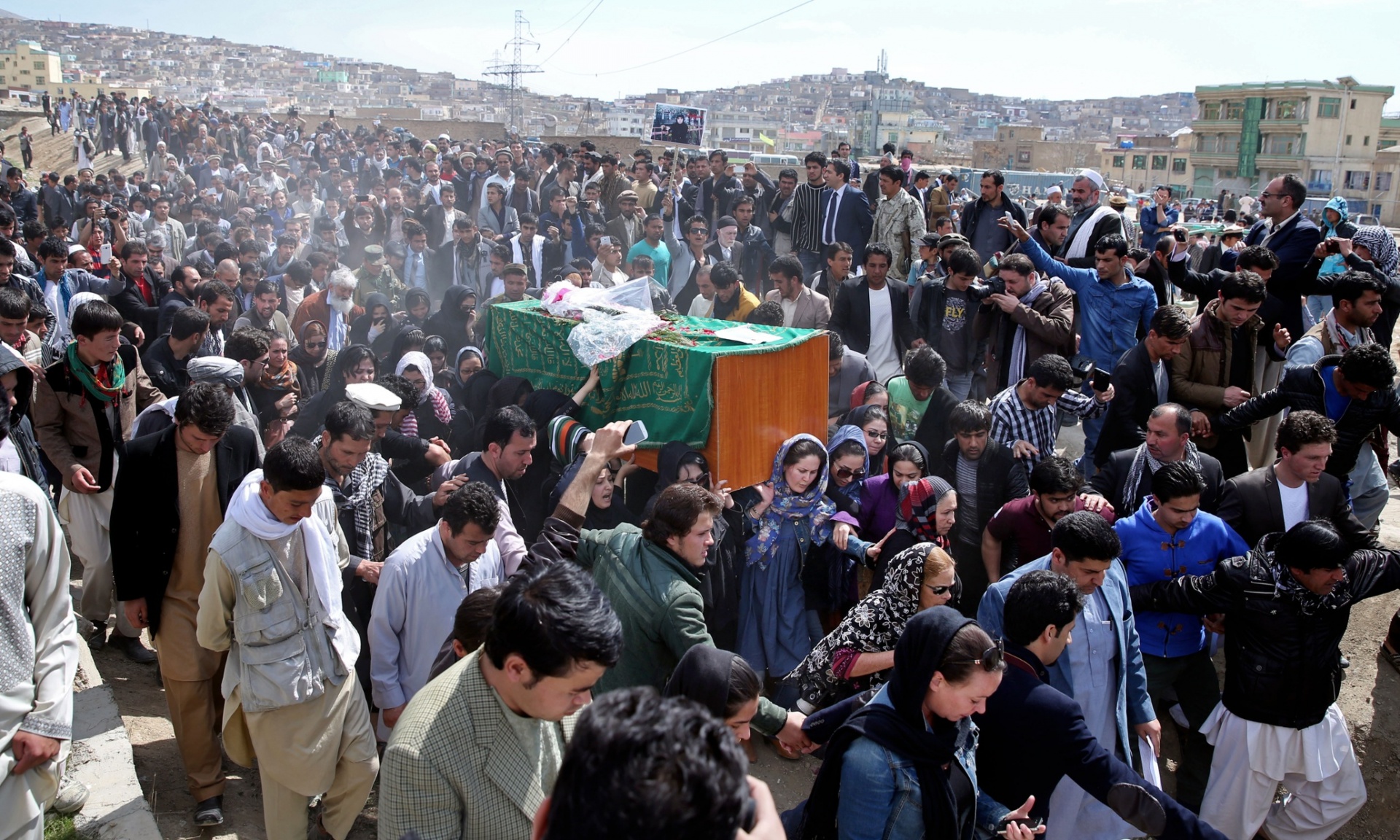 the body of farkhunda 27 who was lynched on thursday by an angry mob in central kabul was carried to the graveyard by women amid crowds of men photo ap