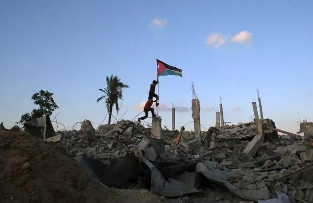 children in khan yunis 039 khuzaa neighbourhood in the southern gaza strip place a palestinian flag on october 1 2014 in the rubble of a building destroyed during the israeli army 039 s summer offensive on the gaza strip photo afp children in khan yunis 039 khuzaa neighbourhood in the southern gaza strip place a palestinian flag on october 1 2014 in the rubble of a building destroyed during the israeli army 039 s summer offensive on the gaza strip photo afp