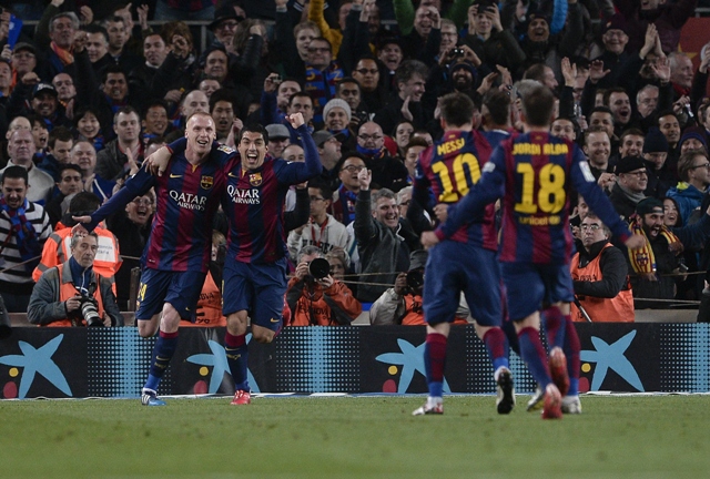 suarez bites real uruguayan forward luis suarez slotted in a sublime winner against real madrid to give barcelona the edge over their domestic rivals in the la liga title race photo afp