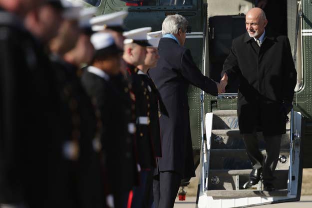 u s secretary of state john kerry c greets afghanistan president ashraf ghani r as they arrive at camp david ahead of talks march 23 2015 in camp david maryland after a series of meetings about security economic development american support for the afghan led reconciliation process the four leaders will hold a news conference photo afp