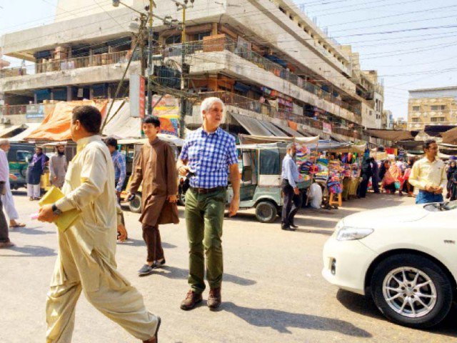 enrique penalosa walks along ma jinnah road on thursday the brts expert is in pakistan to garner support for the system and work with entities such as the adb and bahria town who are in a race to build karachi 039 s first corridor photo mahim maher express