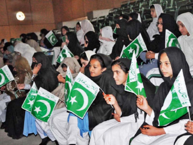 students hold flags at a ceremony in wadudia hall swat photo online students hold flags at a ceremony in wadudia hall swat photo online