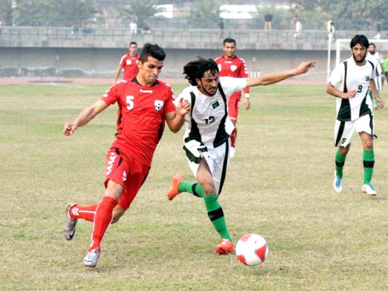 pakistani and yemeni players vie for the ball photo file