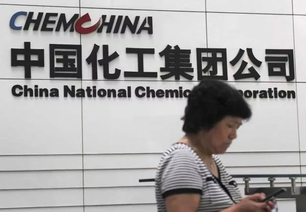 a woman checks her phone at the headquarters of china national chemical corporation in beijing july 20 2009 photo reuters a woman checks her phone at the headquarters of china national chemical corporation in beijing july 20 2009 photo reuters