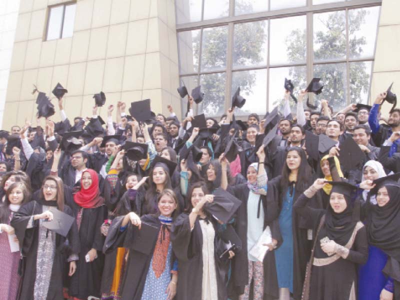 students throwing their caps in the air after the convocation photo abid nawaz express
