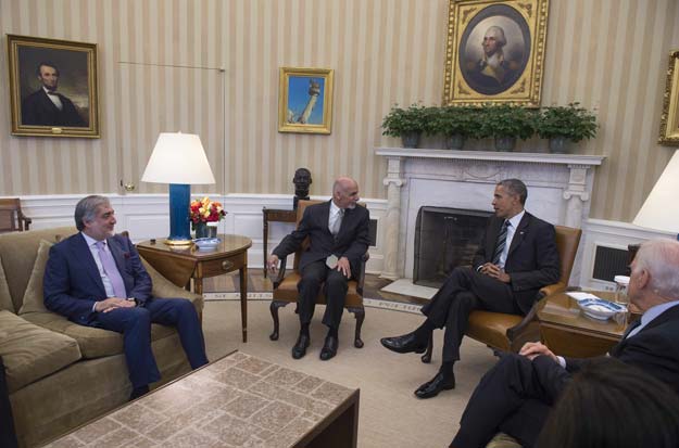 us president barack obama 2nd r speaks with afghan president ashram ghani c and afghan chief executive abdullah abdullah l in the oval office of the white house in washington dc march 24 2015 photo afp