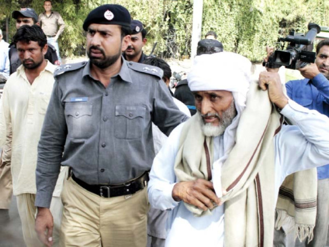 policeman escorting an elderly protester to the police van photo abid nawaz express policeman escorting an elderly protester to the police van photo abid nawaz express