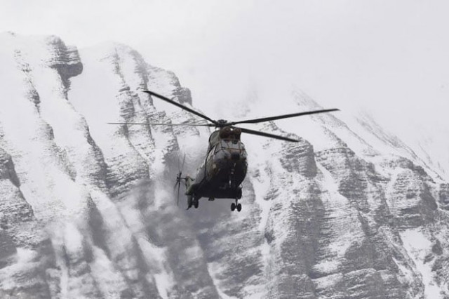a helicopter flies near seyne south eastern france on march 25 2015 near the site where a germanwings airbus a320 crashed in the french alps photo afp a helicopter flies near seyne south eastern france on march 25 2015 near the site where a germanwings airbus a320 crashed in the french alps photo afp