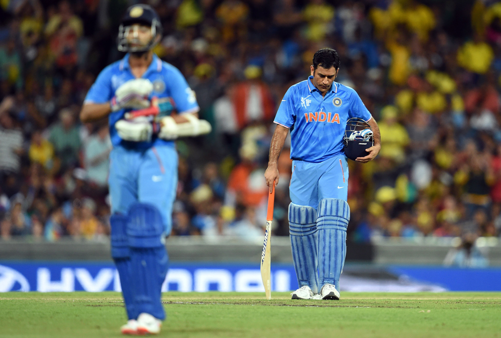 india 039 s captain mahendra singh dhoni r reacts after fellow batsman ajinkya rahane l was dismissed by australia during their 2015 cricket world cup semi final match in sydney on march 26 2015 photo afp