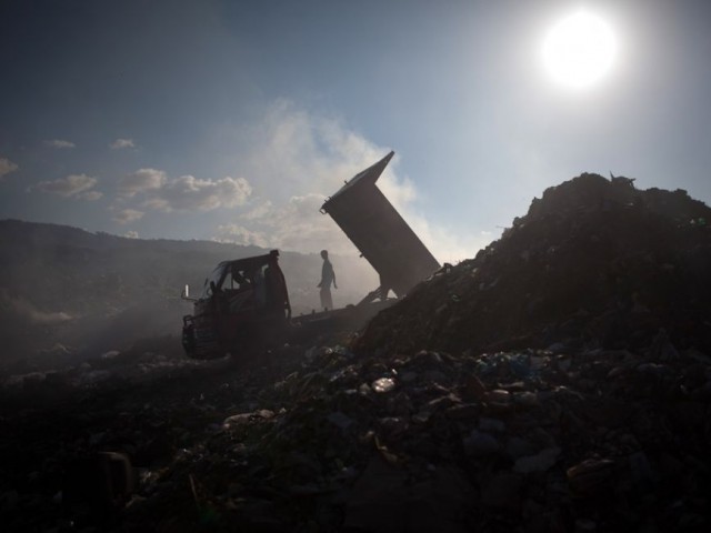 highlighting the salient features of the sindh solid waste management programme he said that karachi produced around 11 000 tons of garbage daily while the private sector earned rs250 million by recycling the waste photo afp