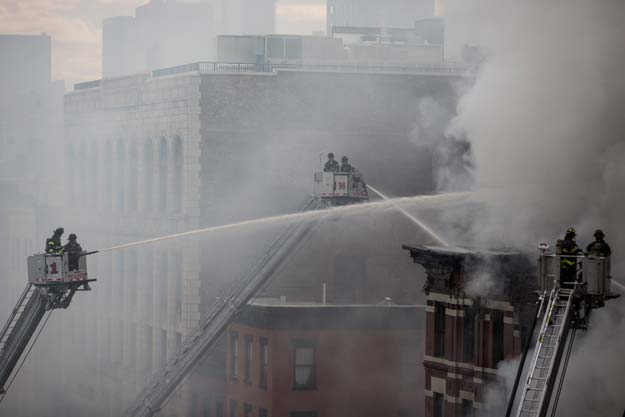 new york firefighters battle a blaze on a commercial and residential block march 26 2015 in new york 039 s east village the entire building at 125 second avenue was engulfed in flames and the lower two floors appeared partially collapsed television footage and press photographs showed twelve people were reported hurt according to fire department officials photo afp