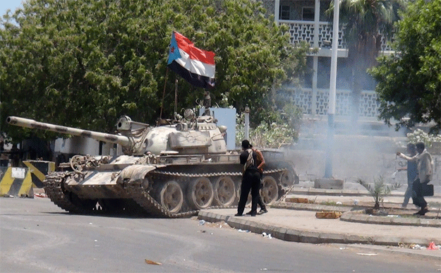 a tank bearing the flag of southern seperatist movement which was confiscated from a military depot is driven on a street in the southern yemeni city of aden photo afp