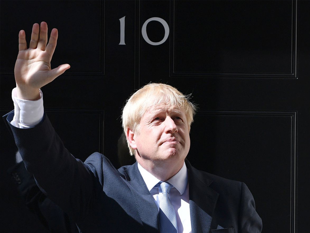 new british prime minister boris johnson waves from the door of no 10 downing street photo getty