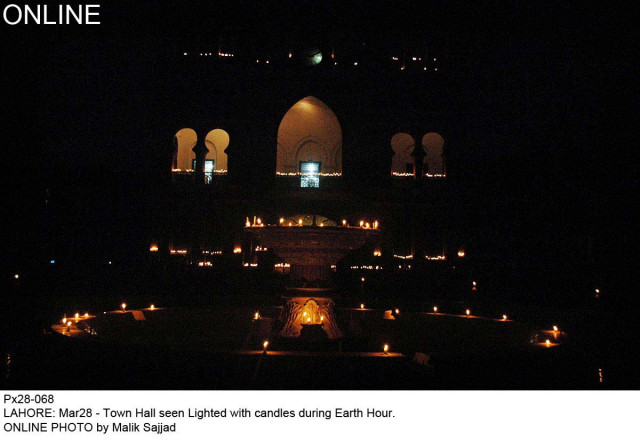 town hall seen lit with candles during earth hour photo online town hall seen lit with candles during earth hour photo online