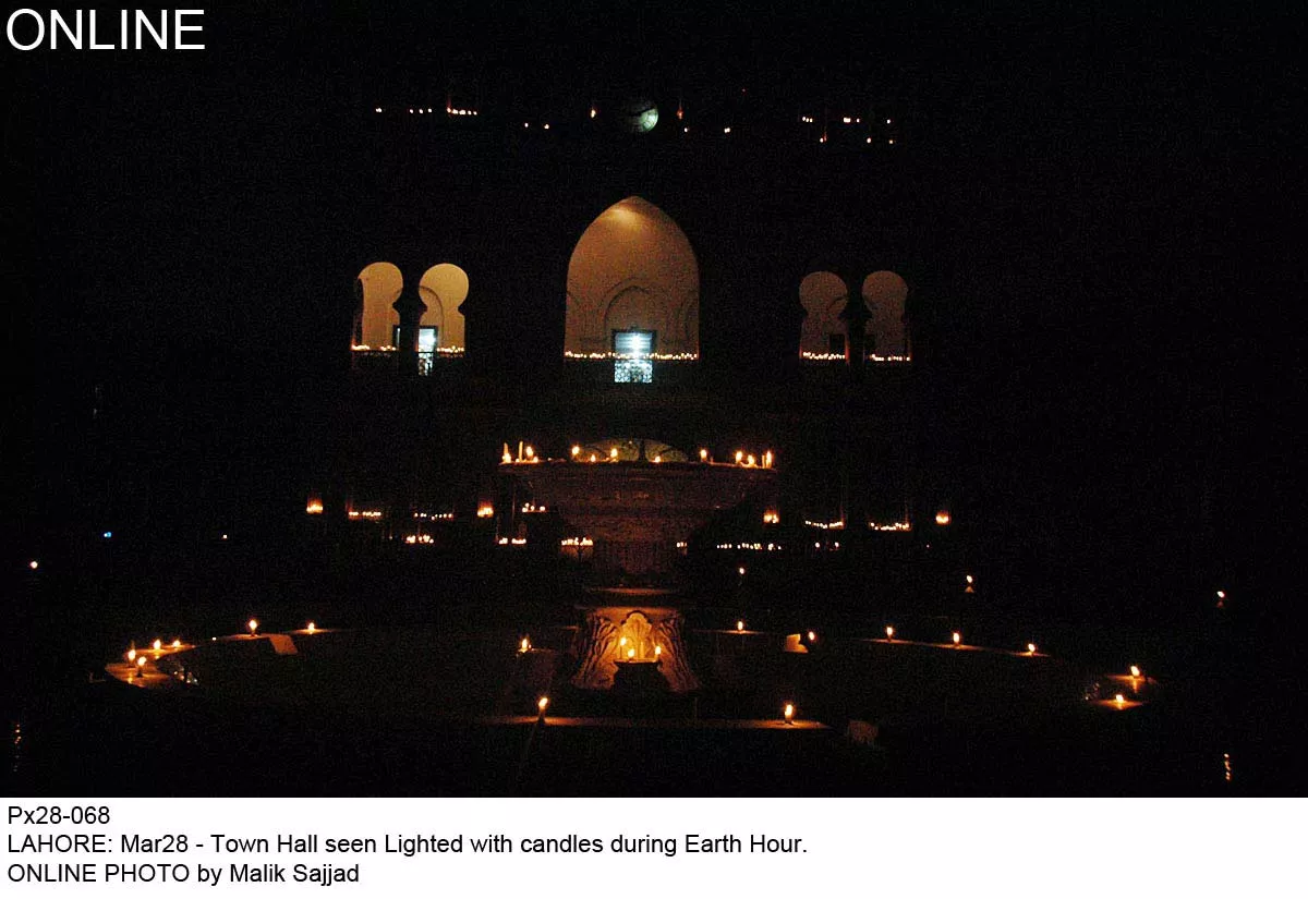 town hall seen lit with candles during earth hour photo online town hall seen lit with candles during earth hour photo online