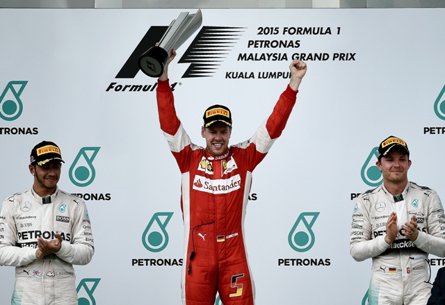 shock win sebastian vettel stunned world champion lewis hamilton and mercedes on sunday with an audacious malaysian grand prix victory which ignited the formula one season photo afp