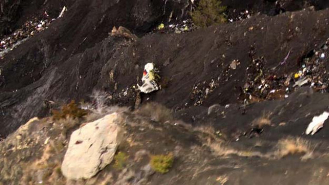 debris from the germanwings airbus a320 is seen strewn over the crash site in the french alps above the southeastern town of seyne les alps photo afp